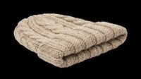Folded beige knit blanket isolated on transparent background, ready for t-shirt design, clipart, stickers, sublimation and print-on-demand products.