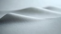 Minimalist snow landscape with smooth rolling hills and gentle curves creating abstract natural patterns in white winter terrain. Soft shadows add depth.