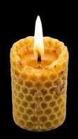 Beeswax candle with honeycomb texture and lit flame, isolated on transparent background. Ready for t-shirt designs, clipart, stickers, print-on-demand products, and sublimation projects.
