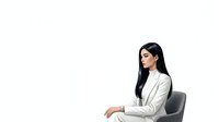 Young woman with long black hair and East Asian ethnicity, wearing a white blazer, seated in a gray office chair against white background. Isolated professional portrait suitable for corporate, business, and corporate training materials.