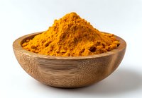 Vibrant orange turmeric powder heaped in wooden bowl against white background, used in cooking, natural medicine, and skincare products.