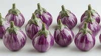 Fresh striped purple eggplants with green stems arranged in rows on white background, organic produce for healthy cooking and food photography.
