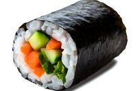 Fresh sushi roll with salmon, cucumber, avocado and carrots wrapped in nori seaweed and white rice, isolated on white background for menu design.
