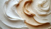 Creamy swirled frosting with smooth texture and delicate bubbles, perfect for bakery desserts, cake decoration and culinary food styling projects.
