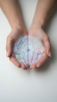 Hands holding glowing sacred geometry mandala with rainbow holographic light effects for spiritual healing and meditation practices.