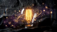 Vintage Edison bulb glowing with warm filament surrounded by magical golden sparks and bokeh lights against dark textured background for creative projects.