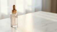 Luxury skincare serum bottle with golden dropper on marble surface in soft natural light for beauty and wellness routines.