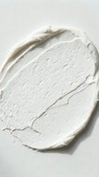 White cream or moisturizer swatch with textured brushstrokes on isolated background, suitable for cosmetics, skincare, and beauty product packaging design.