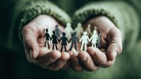 Hands holding paper cutout figures representing diverse community or family, symbolizing unity, support, and social connection.