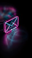 Neon email envelope sign glowing with pink and blue lights on dark background with colorful smoke effects for digital marketing and communication concepts.