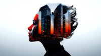 Female profile silhouette with flowing hair merged with modern city skyline at sunset, creating dramatic double exposure effect in black, red and orange tones.