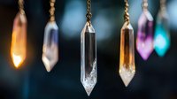 Hanging crystal pendants with golden chains creating mystical energy healing display for meditation and spiritual wellness practices.