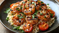 Grilled shrimp with herbs served over rice pilaf with cherry tomatoes in rustic bowl for healthy seafood dinner recipes and cooking content.