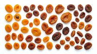 Fresh and dried apricots and dates arranged in organized rows on white background, healthy organic fruit snacks for cooking and nutrition concepts.