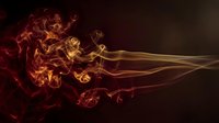Dynamic fire flames with flowing smoke trails on dark background for creative design projects and artistic compositions.