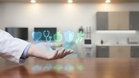 Doctor's hand holding glowing health and wellness icons above wooden desk in modern medical office, representing healthcare technology and digital medicine services.
