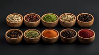 Variety of colorful spices and seasonings in wooden bowls arranged in two rows on dark background, overhead view of aromatic cooking ingredients.