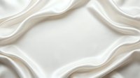 Luxurious white silk fabric with flowing waves and soft folds creating elegant drapery texture for premium fashion and interior design backgrounds.