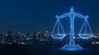 Glowing digital scales of justice overlay modern city skyline at night, representing law, legal services, technology, and urban governance for corporate and professional use.