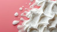 Creamy white meringue waves with silver sugar sprinkles on pink background, soft peaks and swirls creating elegant dessert texture pattern for confectionery design.
