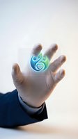 Businessman hand holding glowing eco-friendly heart symbol representing sustainable business practices and environmental responsibility concept.