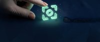 Hand holding glowing green target focus icon symbol on dark blue background representing precision aiming goal achievement business strategy concept.