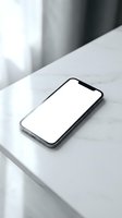 Modern smartphone with blank white screen lying on white marble surface in minimalist interior setting for app presentation and digital mockup design.