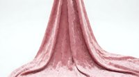 Dusty rose velvet fabric with luxurious draping and soft texture, suitable for fashion design, interior decoration, and textile projects.