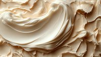 Creamy beige frosting swirls with smooth texture and rich peaks for bakery desserts and culinary applications.