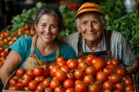 Happy farmers displaying fresh harvested tomatoes at local market, multi-generational family business showing organic produce and sustainable agriculture.