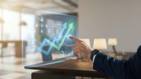 Businessman in dark suit touching holographic upward trending arrow chart on transparent digital display, representing financial growth and business analytics in modern office environment.