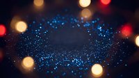 Blue glitter sparkles with colorful bokeh lights creating magical festive atmosphere for celebrations and holiday decorations.