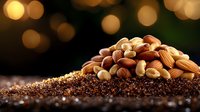 Mixed nuts and seeds pile on textured surface with warm golden bokeh lights background for healthy snacking and nutrition concepts.