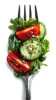 Fresh mixed salad with cucumber, tomato and greens on fork isolated on white background for healthy eating and diet concepts.