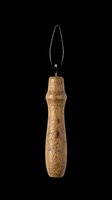 Vintage wooden handle awl tool with metal pointed tip, isolated on transparent background, ready for design use on t-shirts, clipart, stickers, and print-on-demand products.