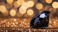 Black diamond on golden glitter surface with blurred bokeh lights background creating luxurious atmosphere. Gemstone reflects light dramatically against sparkly setting.