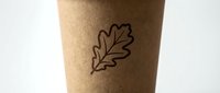 Kraft paper cup with simple oak leaf line drawing design, suitable for beverage packaging, eco-friendly branding, and sustainable product mockups.