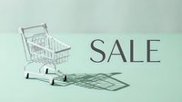 Miniature shopping cart with sale text on mint green background, casting elegant shadows for retail and discount promotion concepts.