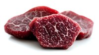 Fresh raw beef steaks with marbled texture isolated on white background for culinary and cooking projects.
