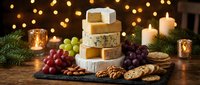 Gourmet cheese platter with grapes, nuts and crackers on wooden board with warm candlelight and festive bokeh lights creating cozy holiday atmosphere.
