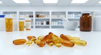 Omega-3 fish oil capsules scattered on white pharmacy counter with medicine bottles and shelves in blurred background for health supplements.