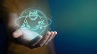 Business professional holding glowing holographic icons representing teamwork, leadership and corporate strategy in open palm for presentations.