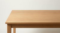 Wooden table with natural light oak finish and simple legs isolated on white background, suitable for furniture design, interior mockups, and product presentations.