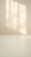 Soft natural sunlight casting palm leaf shadows on neutral beige wall creating minimalist tropical ambiance for interior design and wellness spaces.