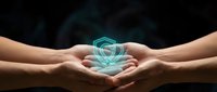 Hands holding glowing shield symbol representing data protection, cybersecurity, and digital safety for technology and business concepts.
