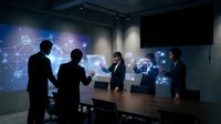 Business professionals analyzing global network data projections in modern conference room with interactive holographic displays and world map visualization.