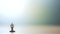 Woman practicing yoga meditation pose on minimalist background with soft natural lighting and peaceful atmosphere for wellness and mindfulness concepts.