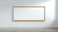 Empty wooden frame hanging on white wall in modern minimalist interior space ready for artwork display and home decoration projects.