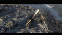 Elegant black and gold fountain pen resting on textured stone surface in dramatic lighting, creating contrast between smooth metal and rough natural texture.
