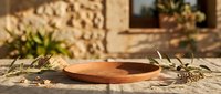 Wooden bowl with olive branches on rustic stone surface, Mediterranean style tableware for dining, food styling, and home decor projects.